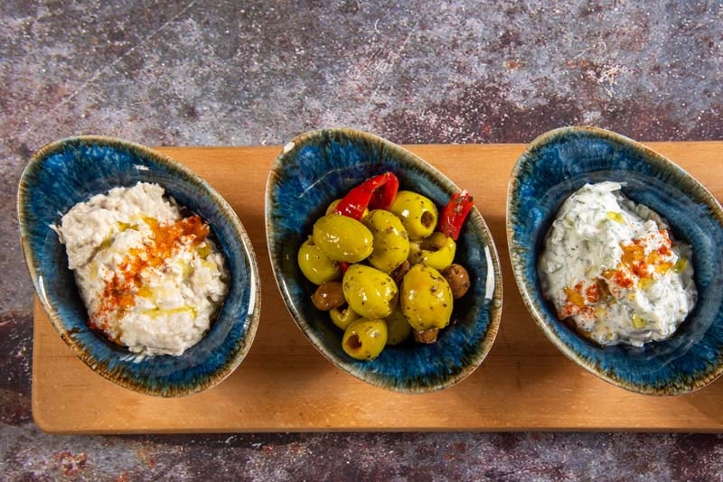 Mezze — hummus, olives and tzatziki