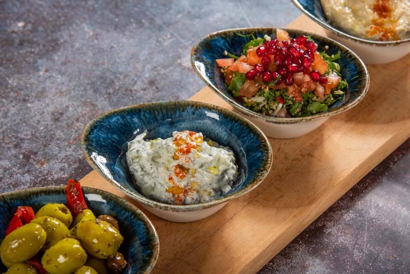 Mediterranean appetisers on wooden board